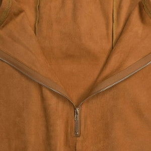 Caramel suede dress with asymmetrical neckline and zipper detail.