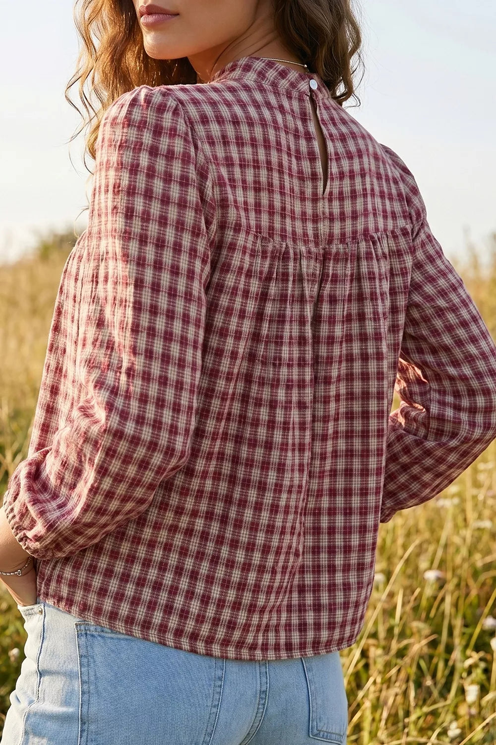 Country plaid long sleeve blouse with button keyhole detail in burgundy and cream.