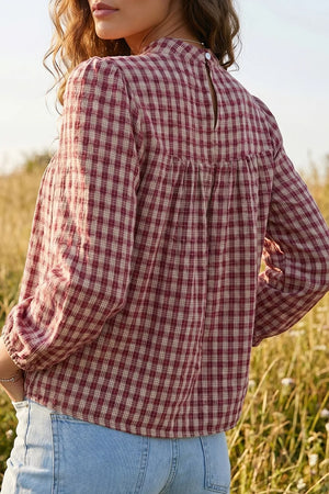 Country plaid long sleeve blouse with button keyhole detail in burgundy and cream.