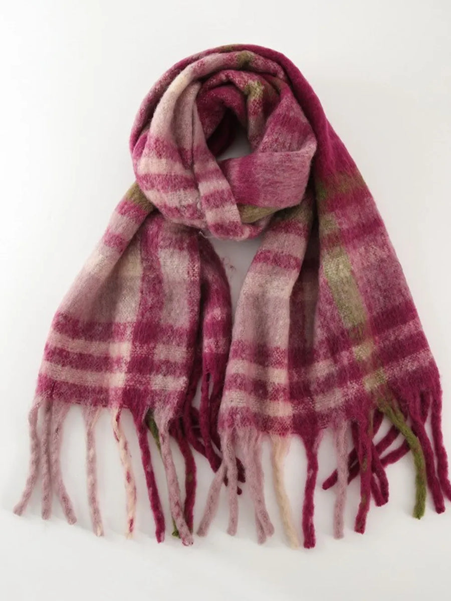 Textured plaid fringe wrap scarf in pink/white/gray plaid with fuzzy texture.