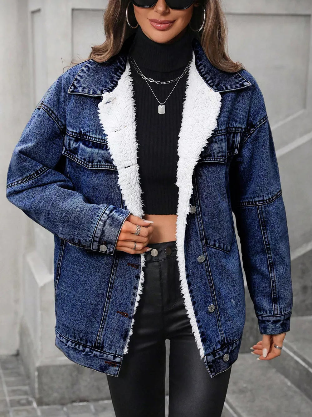 denim jacket in medium wash blue featuring buttoned and oversized fit