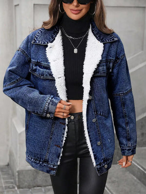 denim jacket in medium wash blue featuring buttoned and oversized fit
