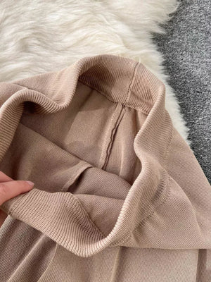Apricot knit two-piece set with wide legs, showing ribbed waistband detail.