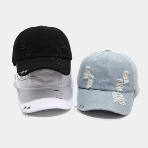 cap in black featuring distressed and fitted fit