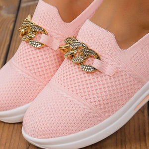 Pink mesh slip-on flats with chunky gold chain detail.
