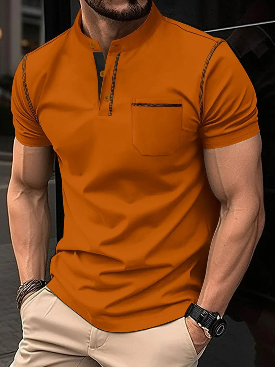 Terracotta polo shirt with mandarin collar, contrast stitching, and chest pocket.