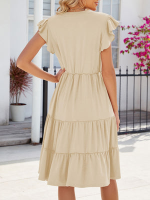 Tan ruffled midi dress with tiered skirt and short flutter sleeves.
