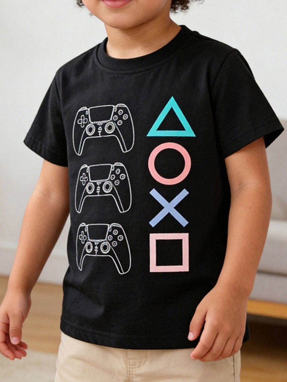 Black toddler t-shirt with gaming controller graphic and colorful button symbols