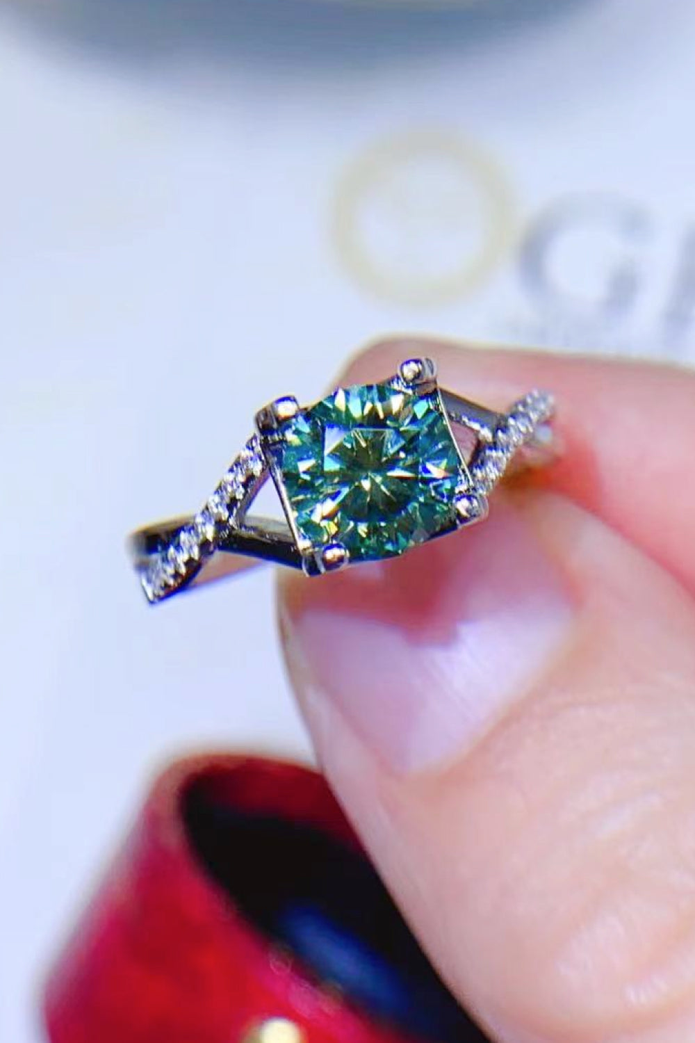 Veridian Halo Sterling Ring with light green center stone and diamond accents