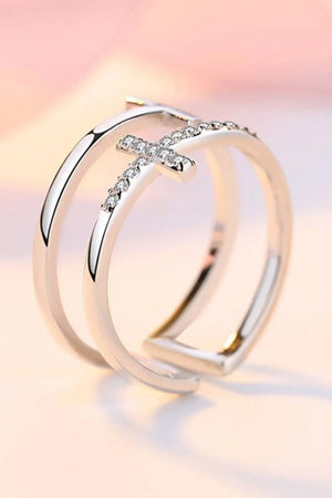 Silver double band ring with a crystal-embellished cross detail.