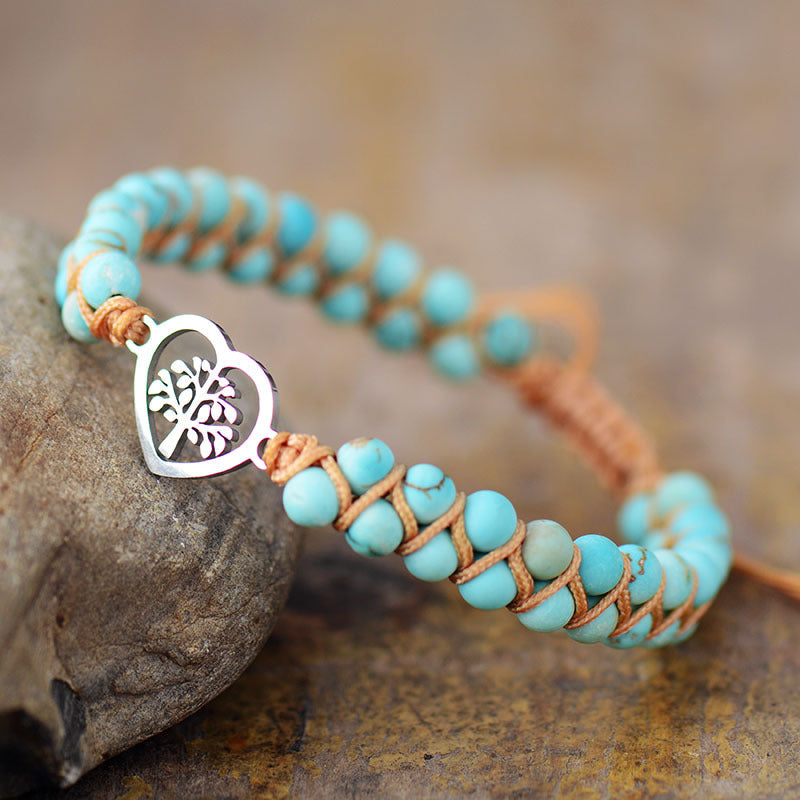 Turquoise bead bracelet with silver heart tree charm and braided cord detail