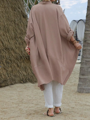Lightweight open front cardigan in dusty pink with rolled sleeves and a relaxed fit.