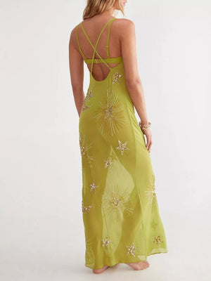 Green sheer cover-up dress with celestial star sequin embellishments and strappy back.