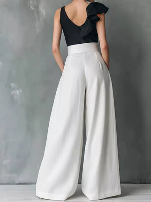 Belted high-waisted wide-leg maternity pants in white with a clean, chic cut.