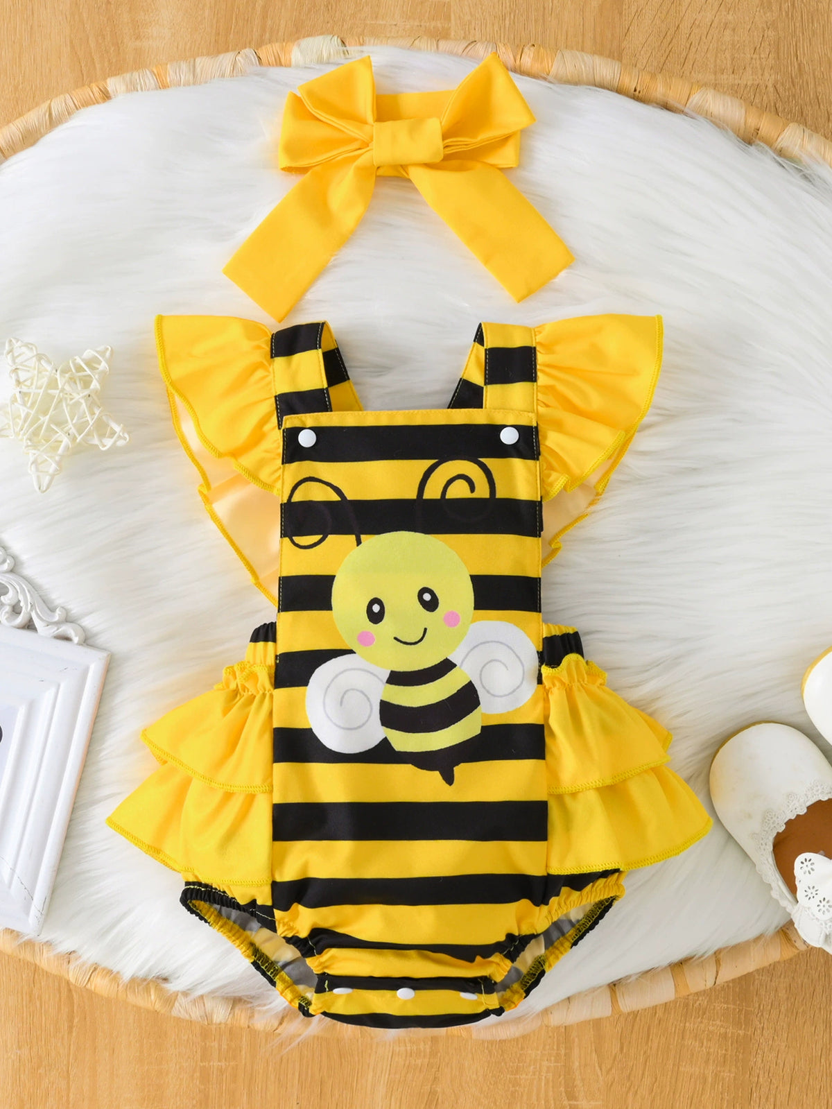 Baby bee striped ruffle bodysuit dress with matching yellow bow headband.