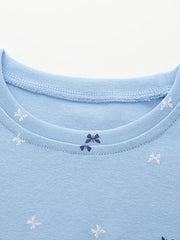 Cerulean cotton baby dress with allover butterfly and bow print.
