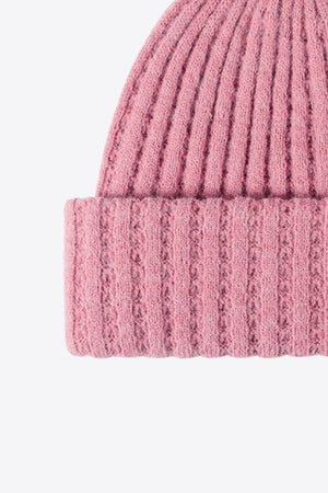 Pink acrylic ribbed knit beanie with textured cuff detail