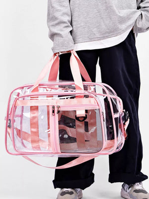 Clear duffel bag with pink stripes and mesh pockets, pink straps and trim