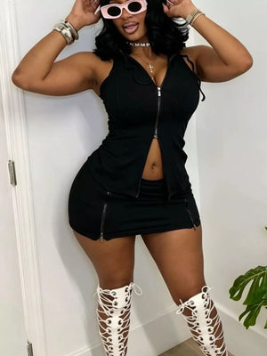 Black hooded zippered two-piece set with skirt and zipper details.