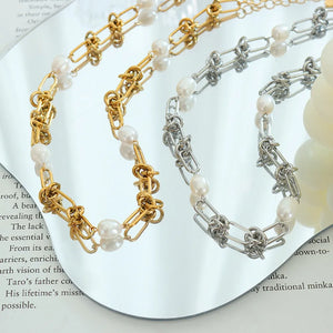 Linked pearl knot collar necklace in gold and silver tones with baroque pearls.