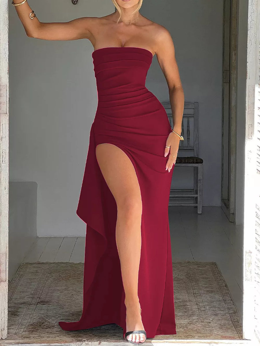 Burgundy strapless maxi dress with ruching and a high slit.