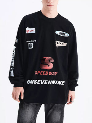 Black long sleeve t-shirt with multiple racing-inspired graphic patches and text details.