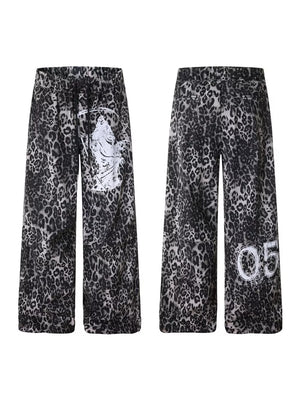 Leopard print cotton sweatpants with drawstring waist and wide legs, featuring graphic print details.