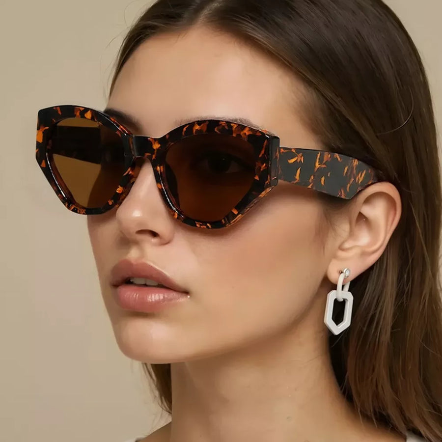 sunglasses in dark brown featuring UV400 protection and cat-eye fit