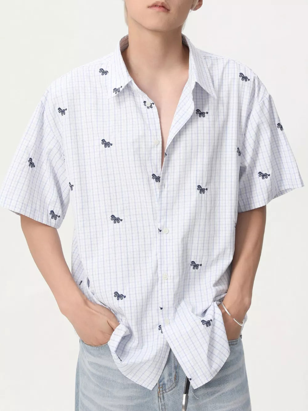 Embroidered animal plaid short sleeve button up shirt in white and blue with a casual fit.