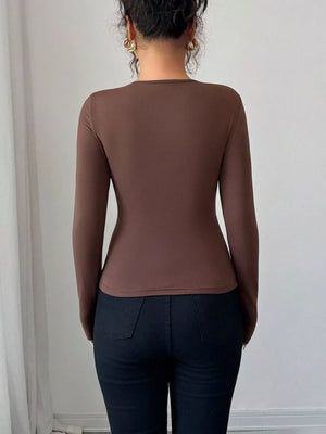 Brown long-sleeve tee with asymmetrical cutout detail.