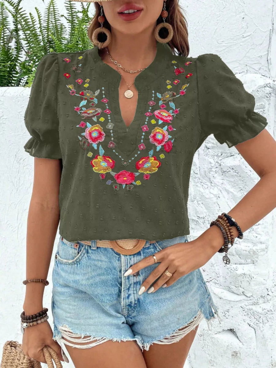 Army green blouse with floral embroidery, puff sleeves, and a V-neck.