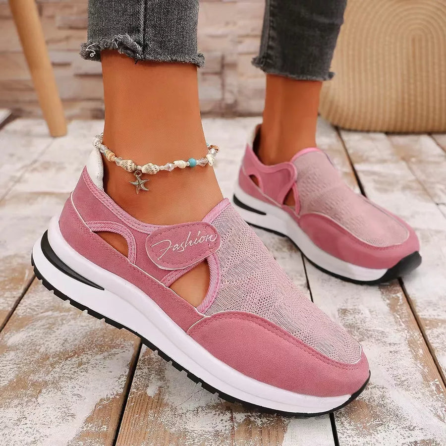 Pink breathable cutout slip-on sneakers with mesh detail and "Fashion" accent.