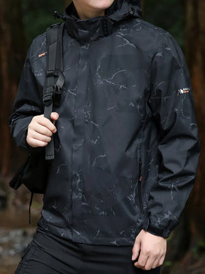 Black windbreaker jacket with marble pattern, hood, and zippered pockets.