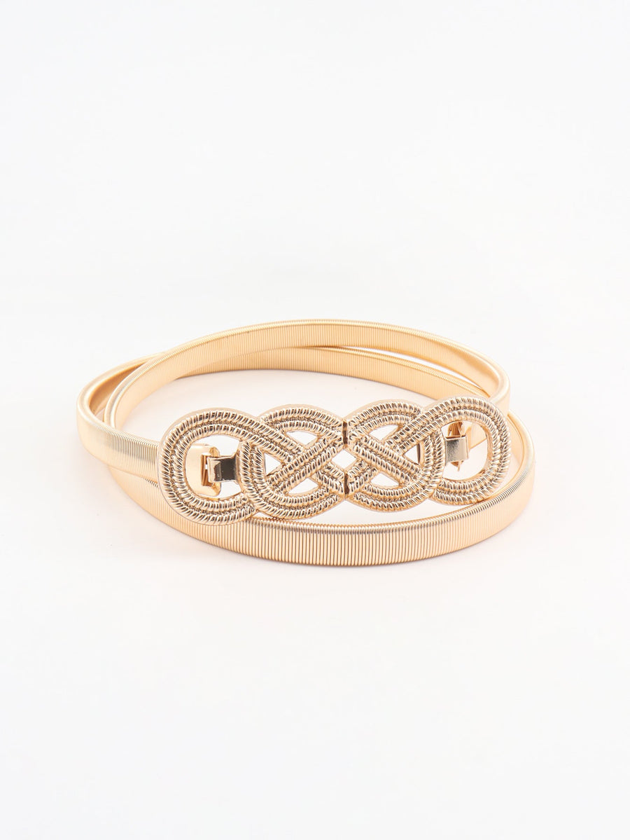 Gold elastic belt with intertwined knot detail and gold buckle clasp