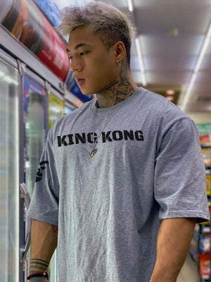 Gray oversized graphic tee with King Kong text and short sleeves.