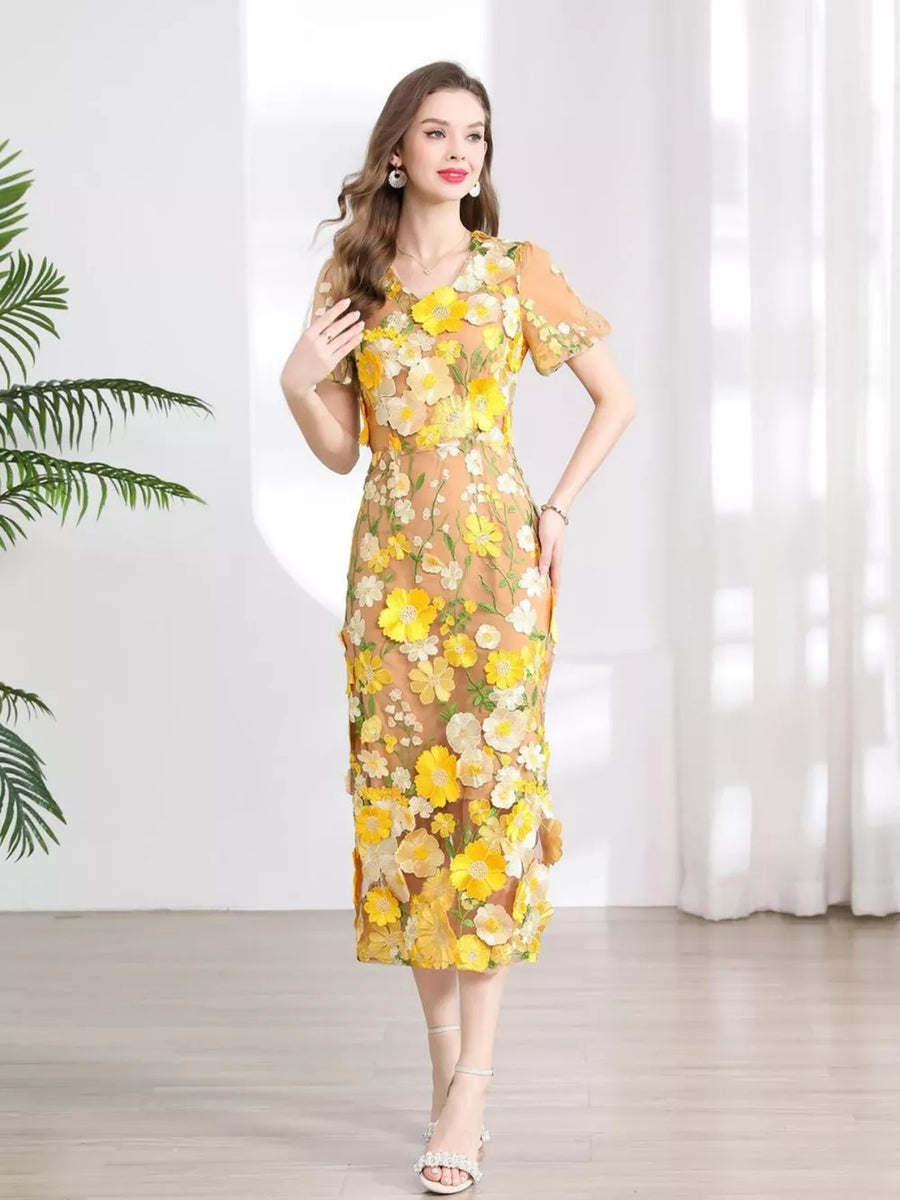 Sheath dress in sheer tan with yellow floral embroidery, V-neck, short sleeves, knee-length.