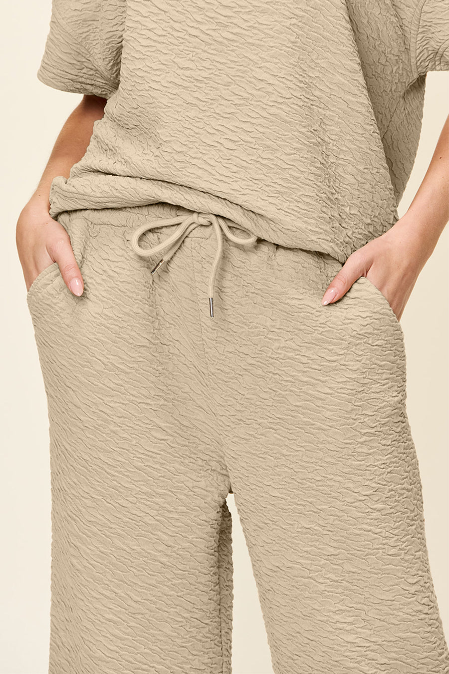 Textured cocoon top and wide leg pants set in khaki with drawstring waist and pockets.