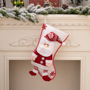 Plush Santa Christmas stocking with red knit sweater and hat, white beard, and striped pants.