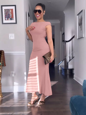 Pink cap sleeve backless maxi gown with boat neckline.