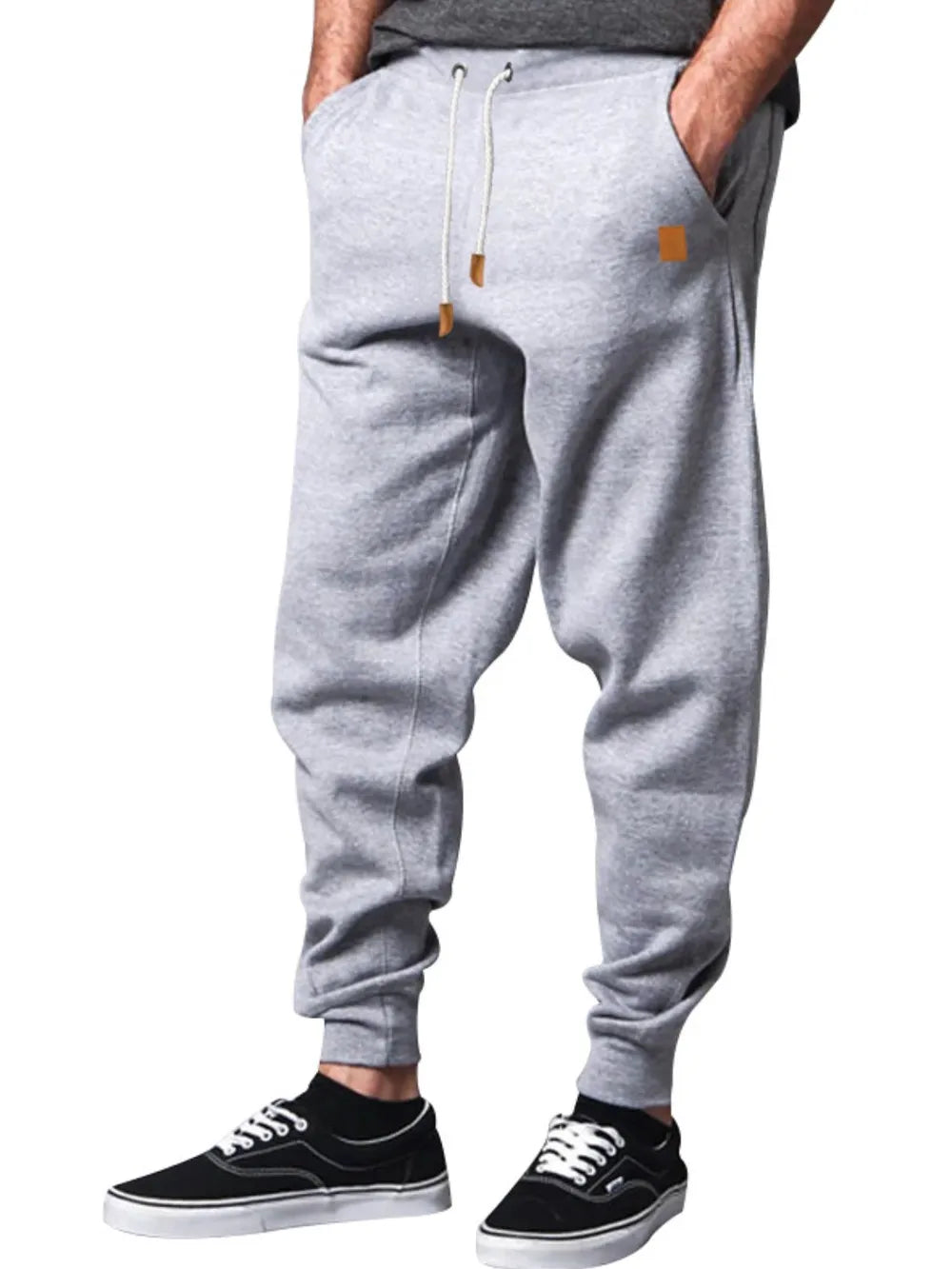 Gray relaxed fit joggers with leather details and drawstring.