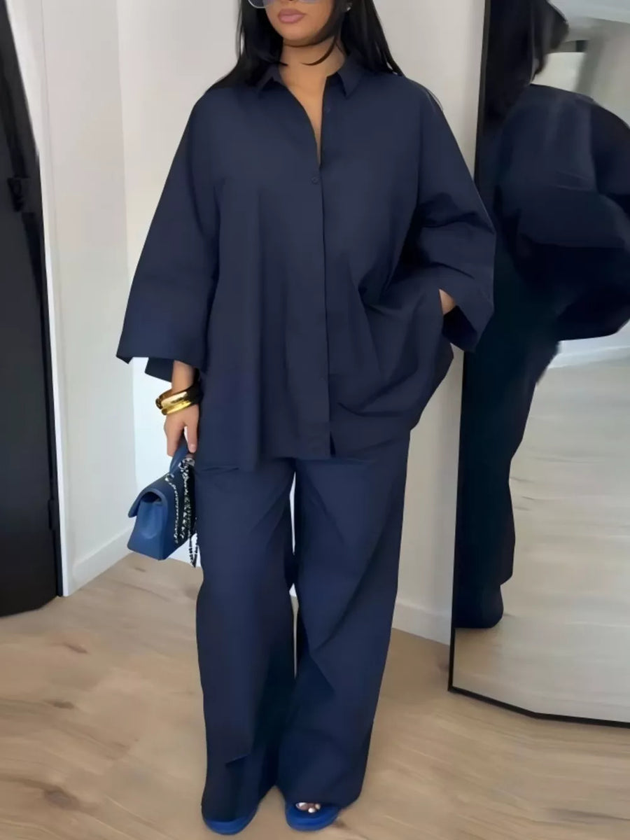 two-piece set in navy blue featuring pocketed and relaxed fit
