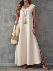 maxi dress in ivory featuring side slit and loose fit
