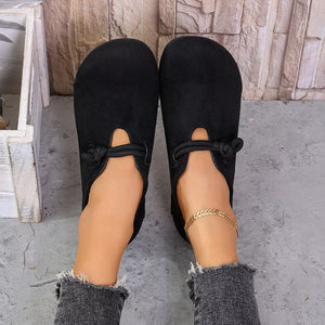 slip-ons in black featuring round toe and flat fit