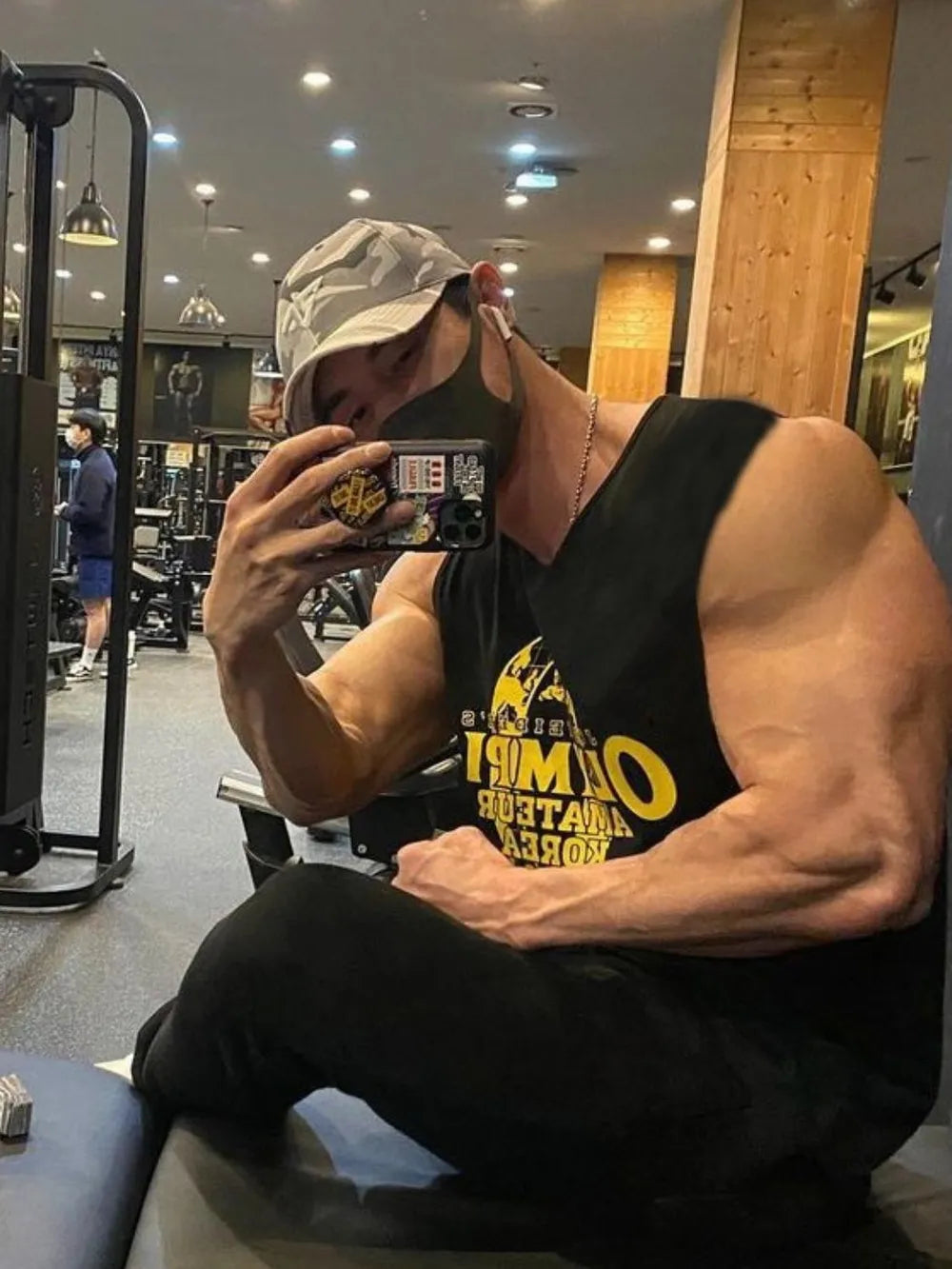 Black graphic muscle tank top with yellow lettering, athletic fit