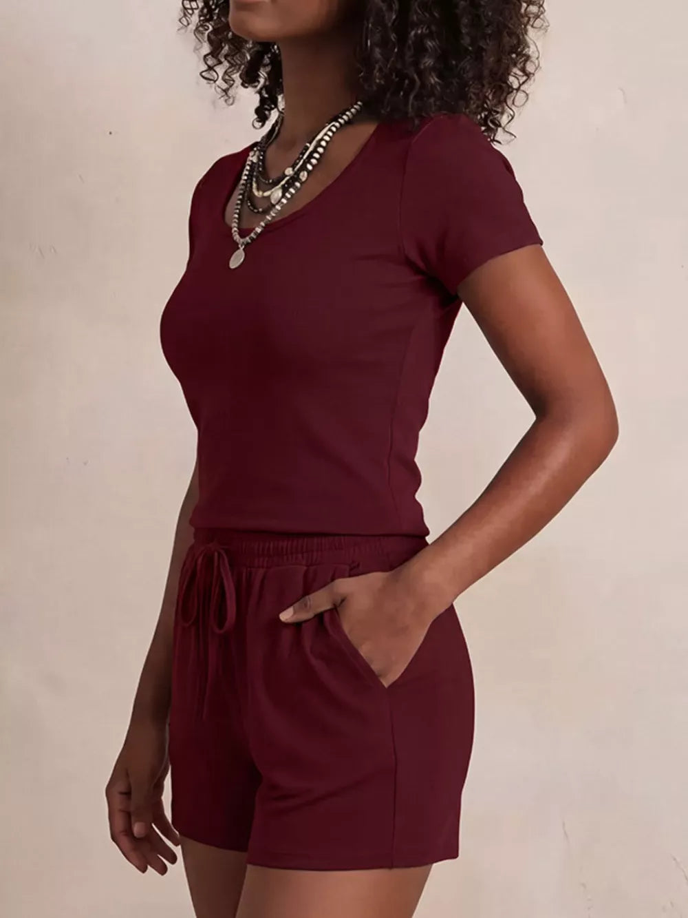 Burgundy scoop-neck tee and drawstring shorts set with pockets.