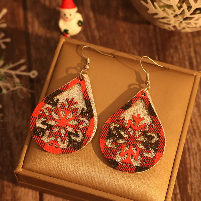 Plaid snowflake drop earrings in deep red with glitter accents.