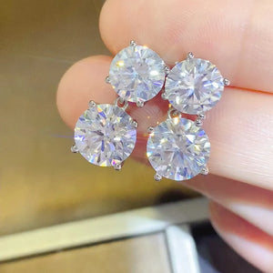 Silver double-drop cubic zirconia stud earrings with four round-cut clear stones.