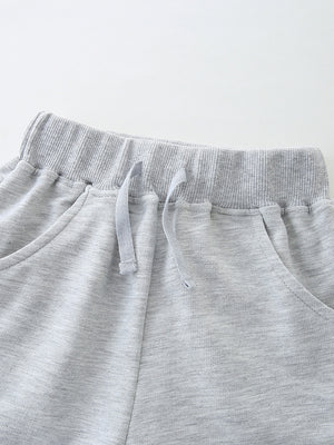 Light grey cotton shorts with elastic waistband and drawstring detail.