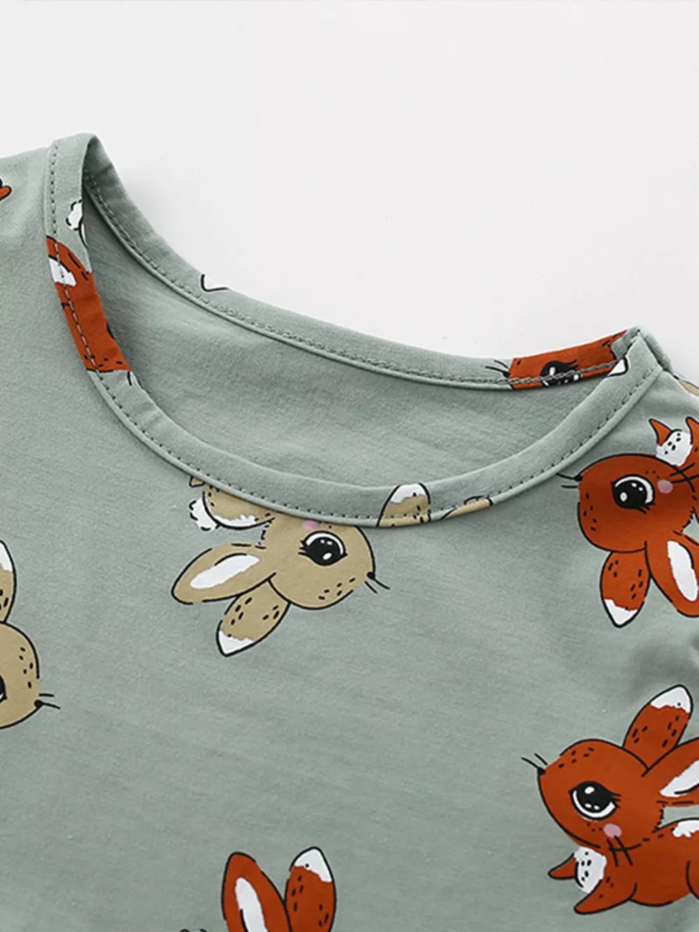 Baby dress with playful bunny print on cotton blend fabric, round neckline.