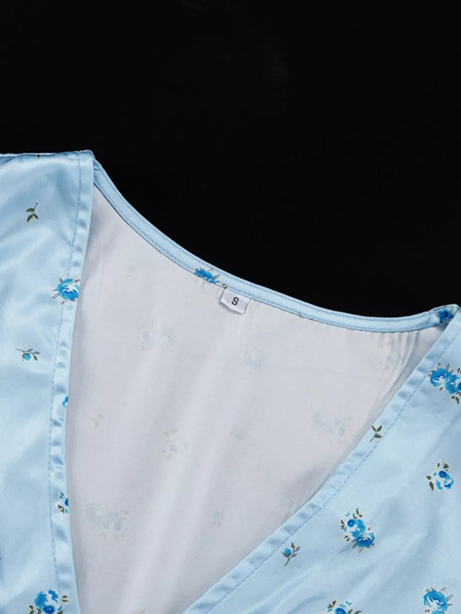 Light blue satin floral print wrap dress with V-neckline